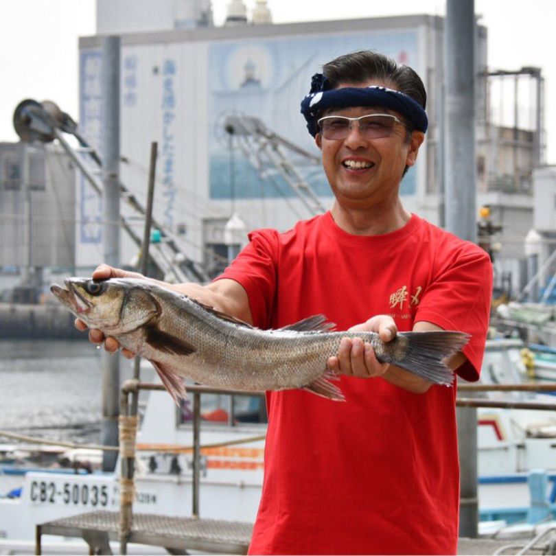Mr. Ono holding a fish